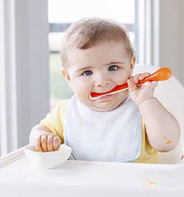 Toddlers in their highchairs